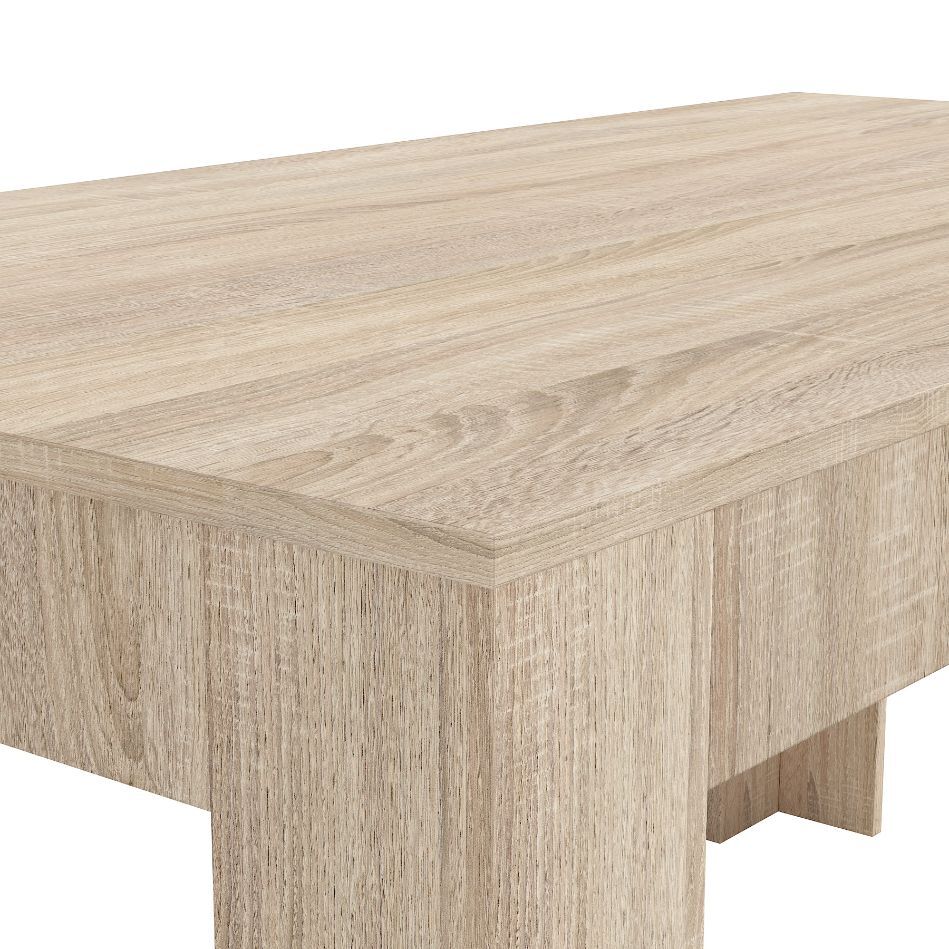 Close-up view of a light wood table, showcasing a smooth, rectangular surface and subtle grain patterns, conveying a modern and minimalist style.
