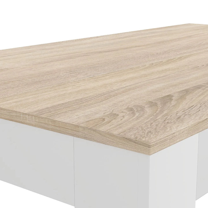 Primer plano de una esquina de una mesa rectangular con un tablero liso de madera clara y paneles laterales blancos. El diseño es minimalista y moderno.