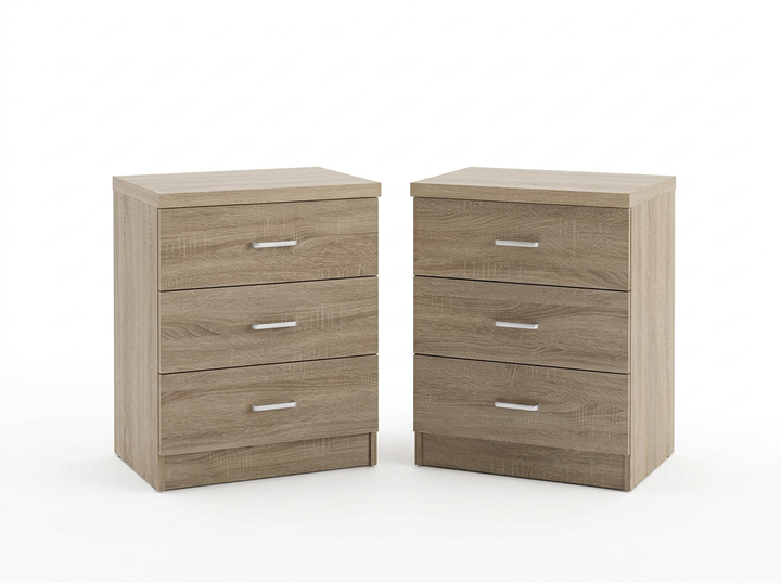 Dos mesitas de noche de madera, cada una con tres cajones y elegantes tiradores plateados, sobre un fondo blanco.