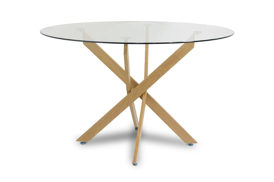 Mesa redonda con tapa de cristal y diseño moderno, con patas de madera clara entrecruzadas que forman un artístico motivo geométrico. Estilo elegante y contemporáneo.
